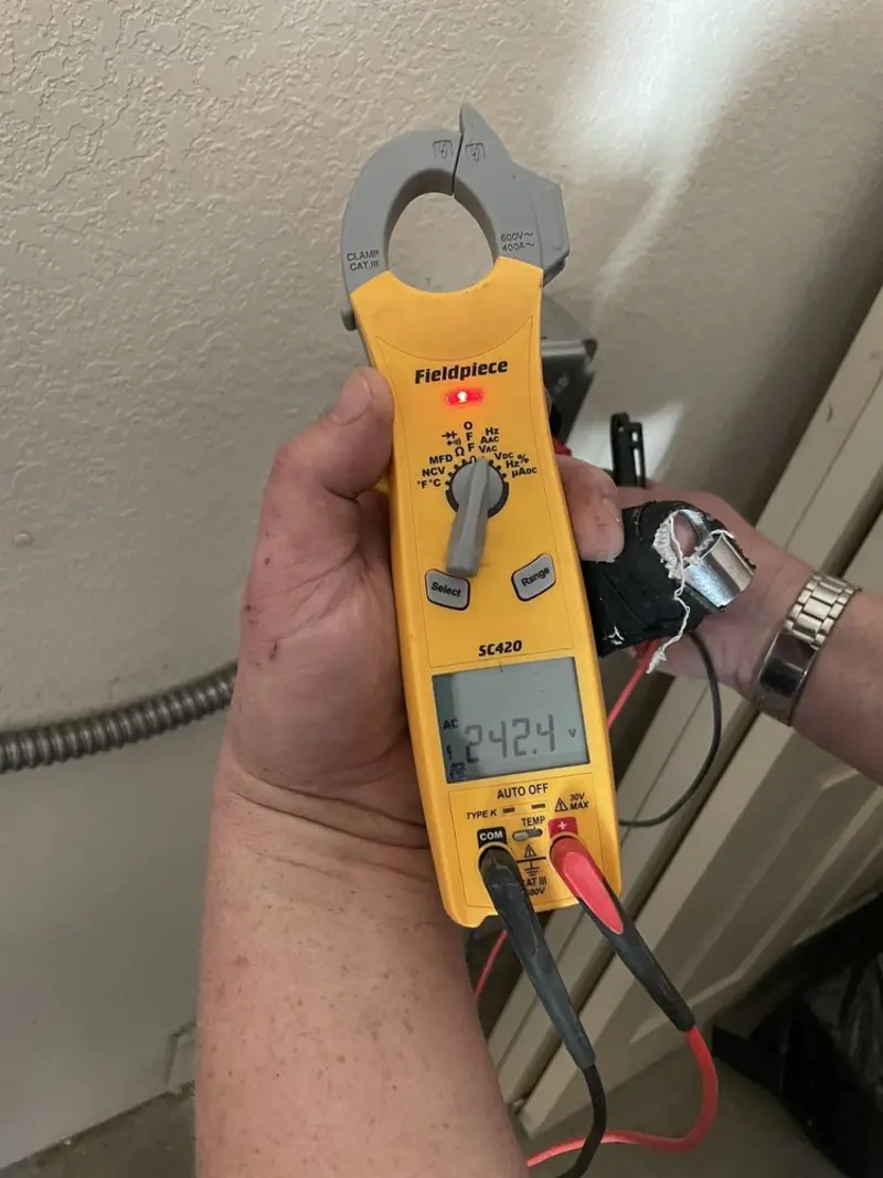 Voltage testing with clamp meter during Recessed Lighting Installation in Hinsdale